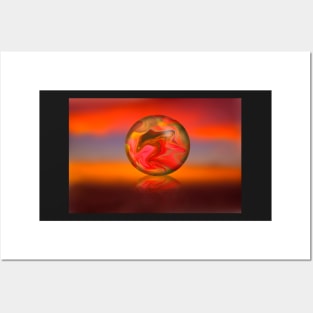 Glass globe on sunset background Posters and Art